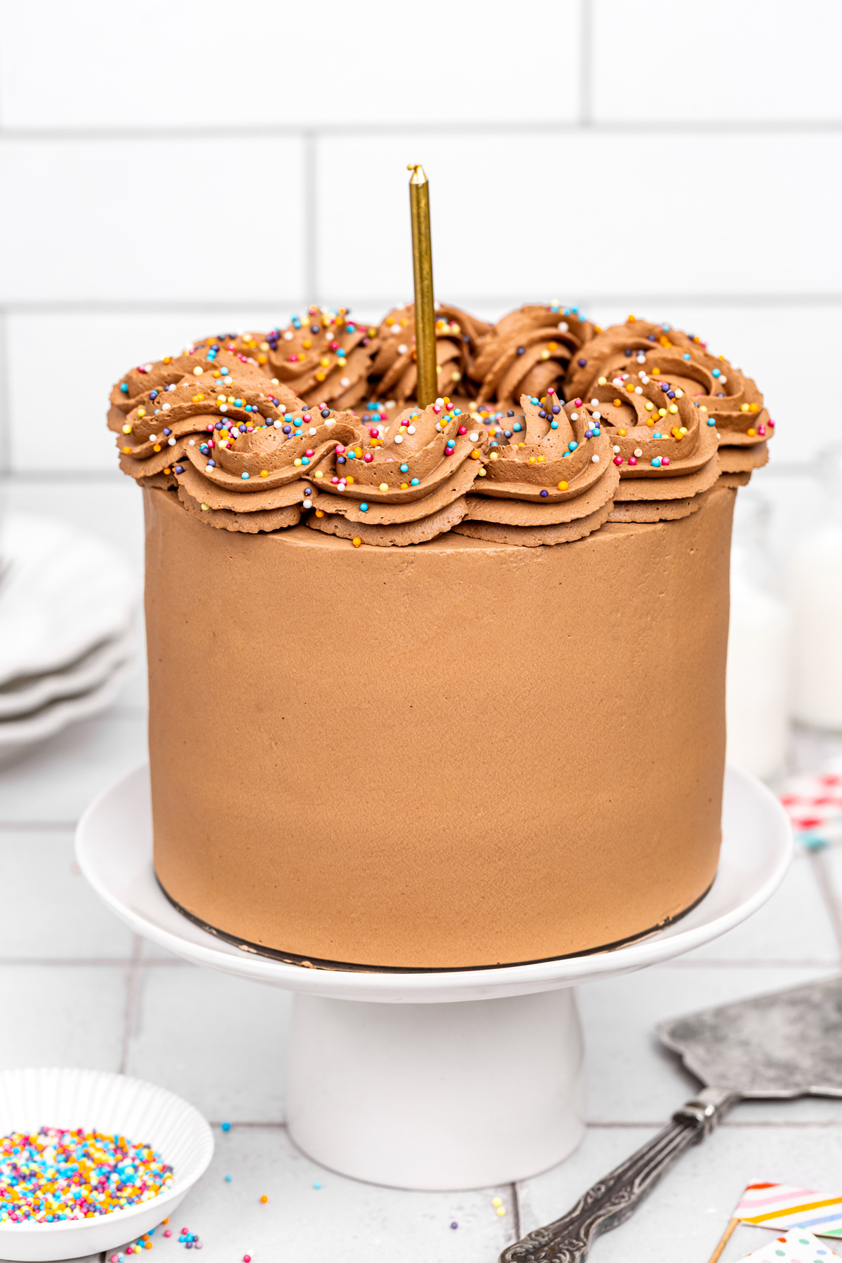 finished chocolate birthday cake with ganache frosting and sprinkles