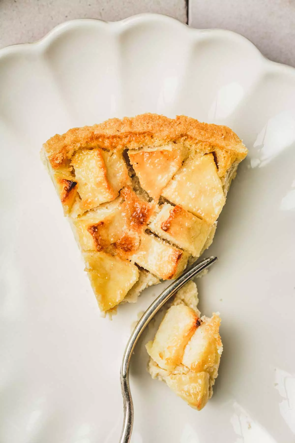 sliced apple tart with a fork