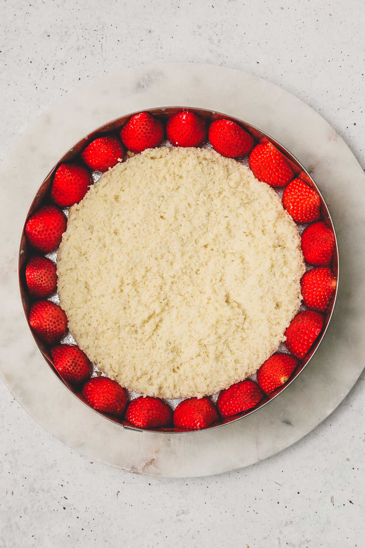 pastry ring with strawberry and a layer of genoise sponge