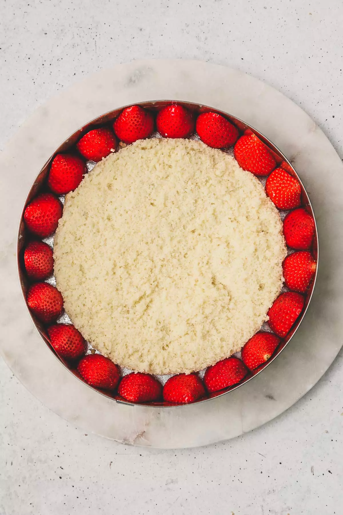 pastry ring with strawberry and a layer of genoise sponge