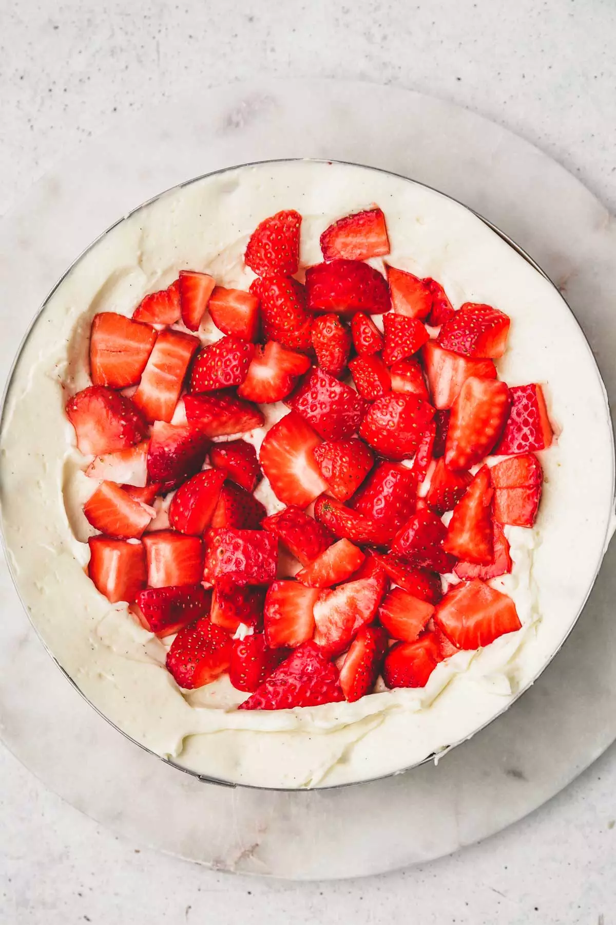 cake ring with chopped strawberries