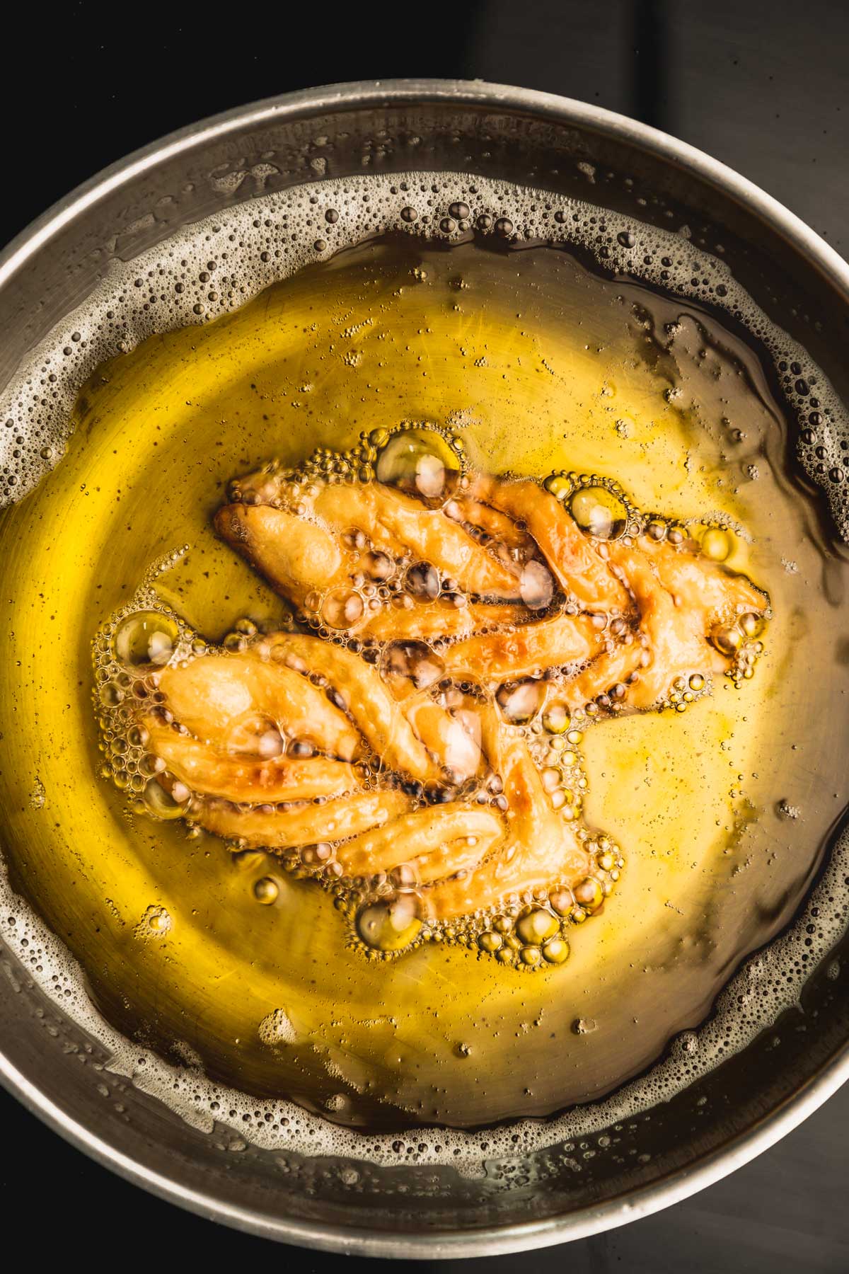 fry pan with chebakia cookies