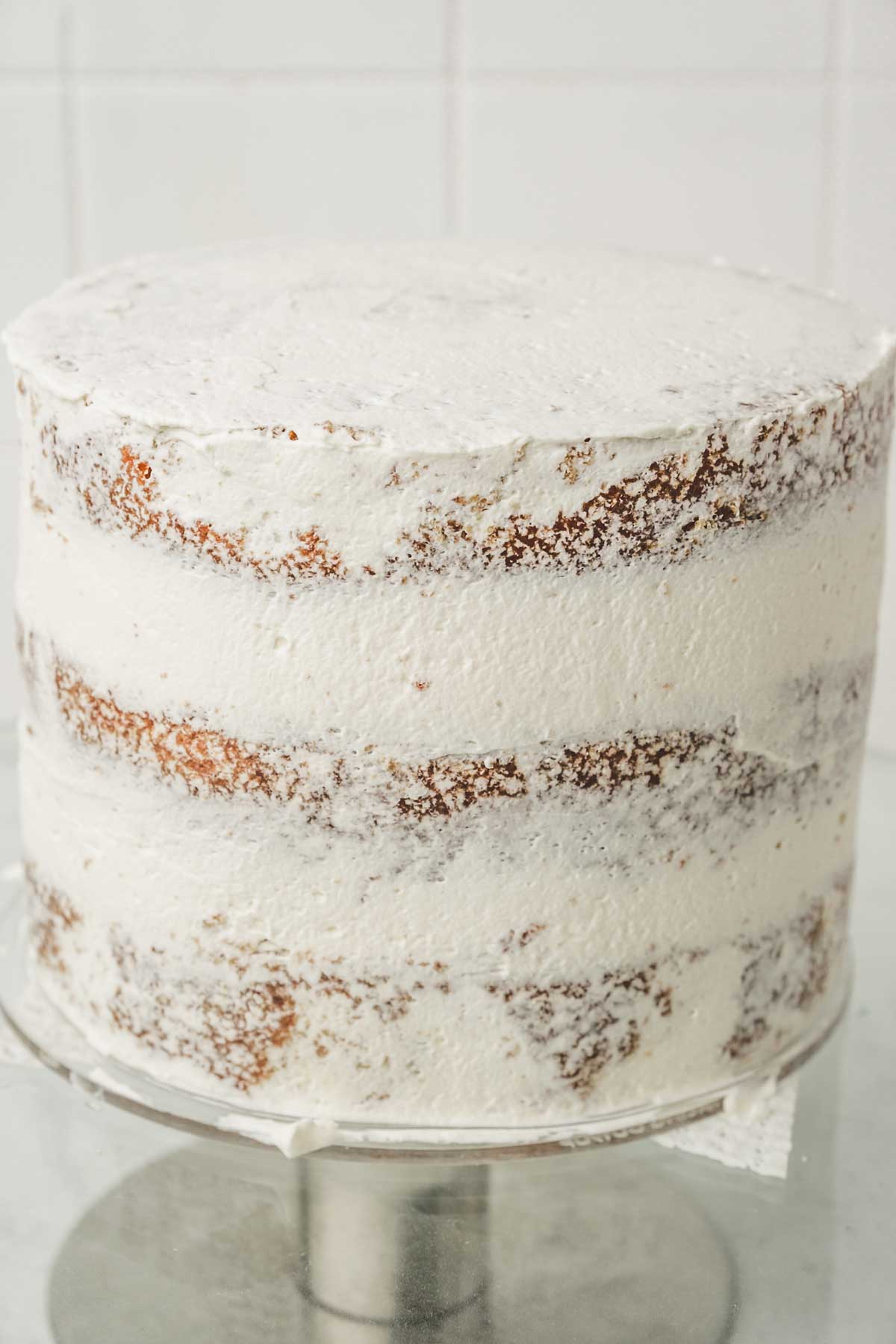 semi naked cake on a cake stand