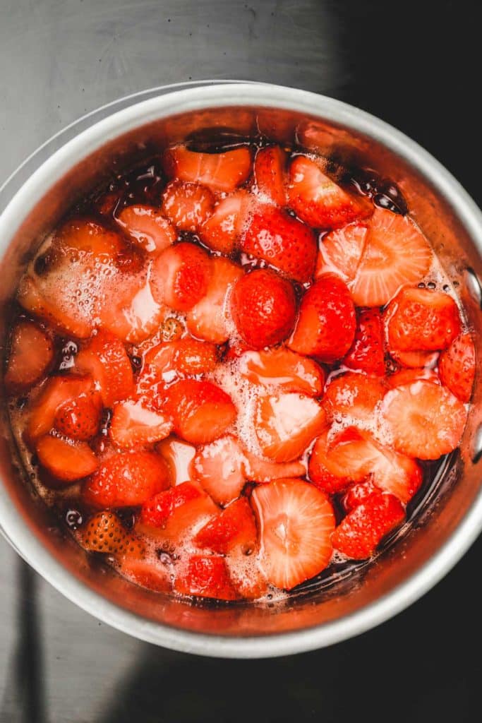 saucepan with strawberry pieces