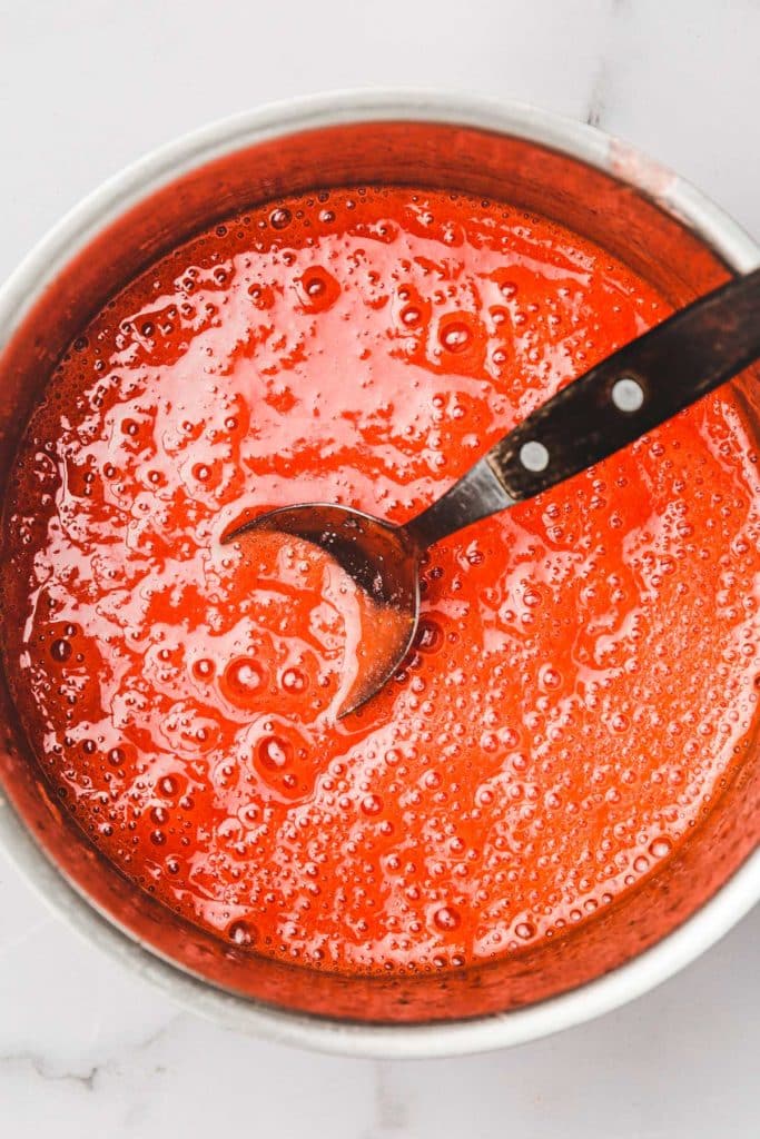 saucepan with strawberry juice