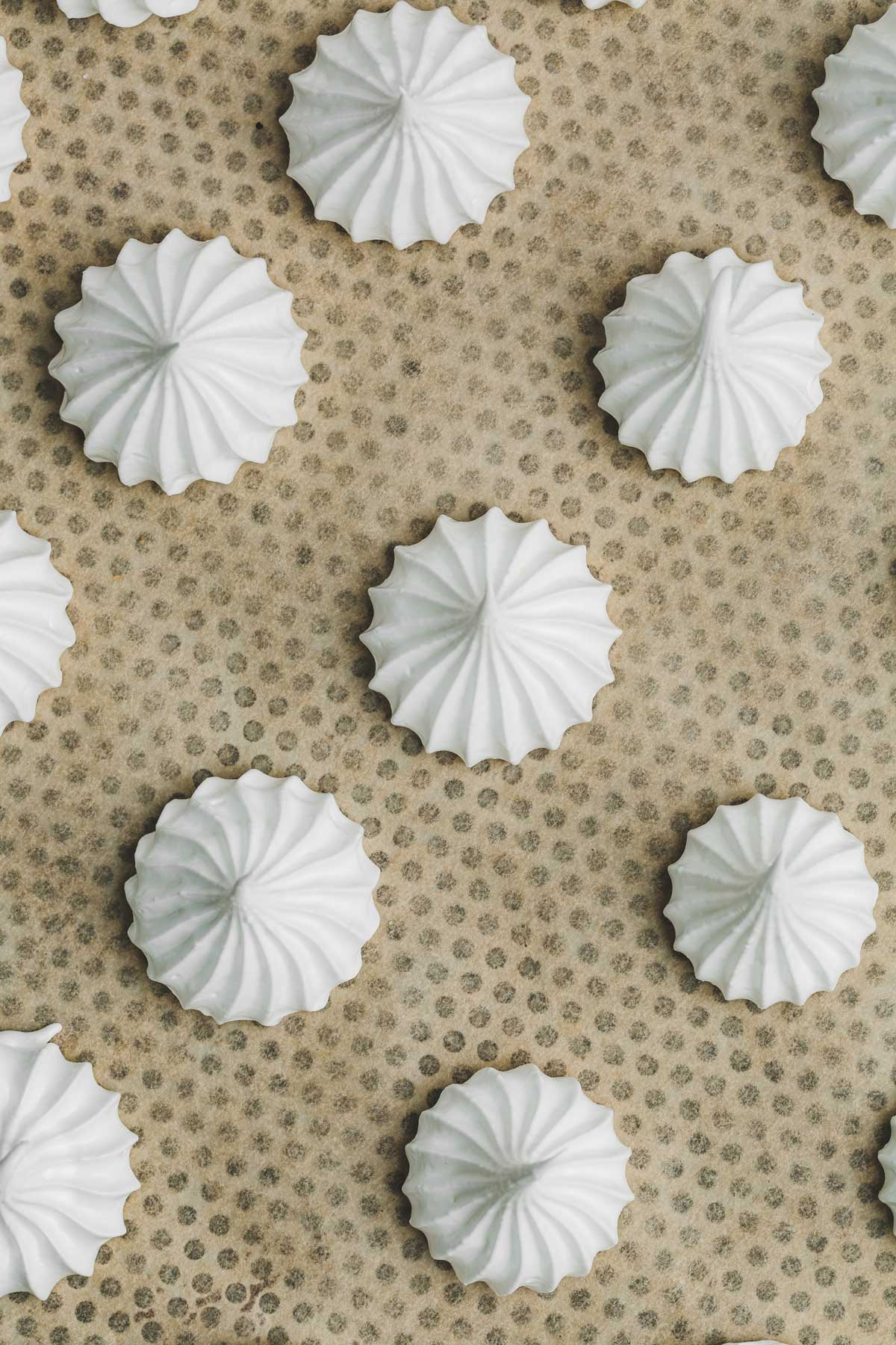 baking sheet with meringue cookies