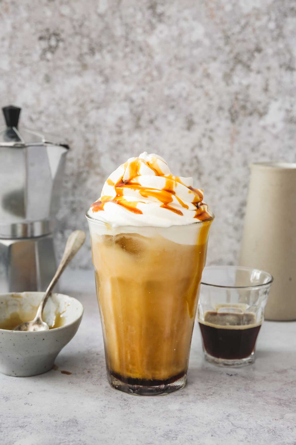 caramel iced coffee glass in a table