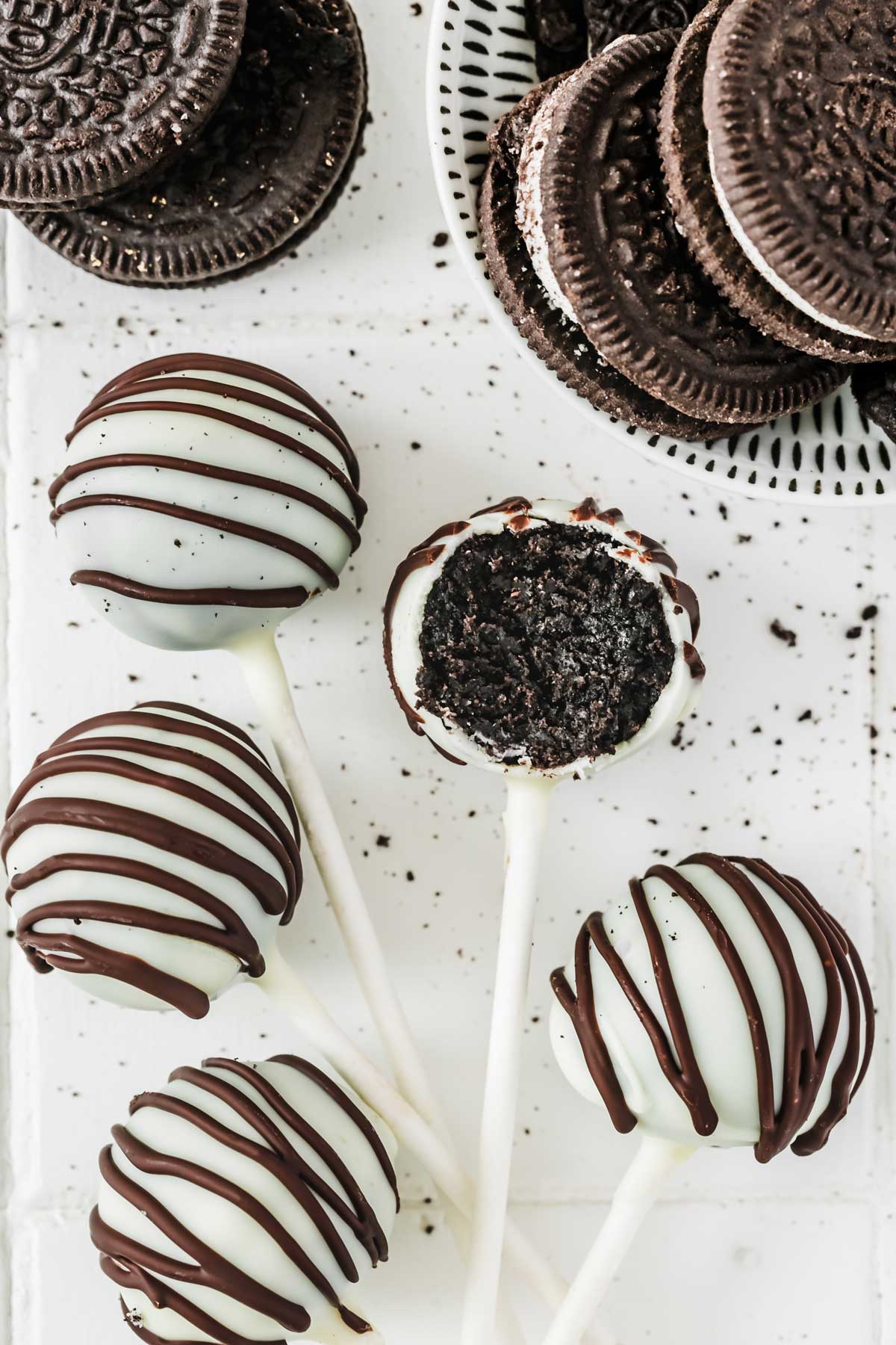 Oreo cake pops with white chocolate drizzle – no bake treat