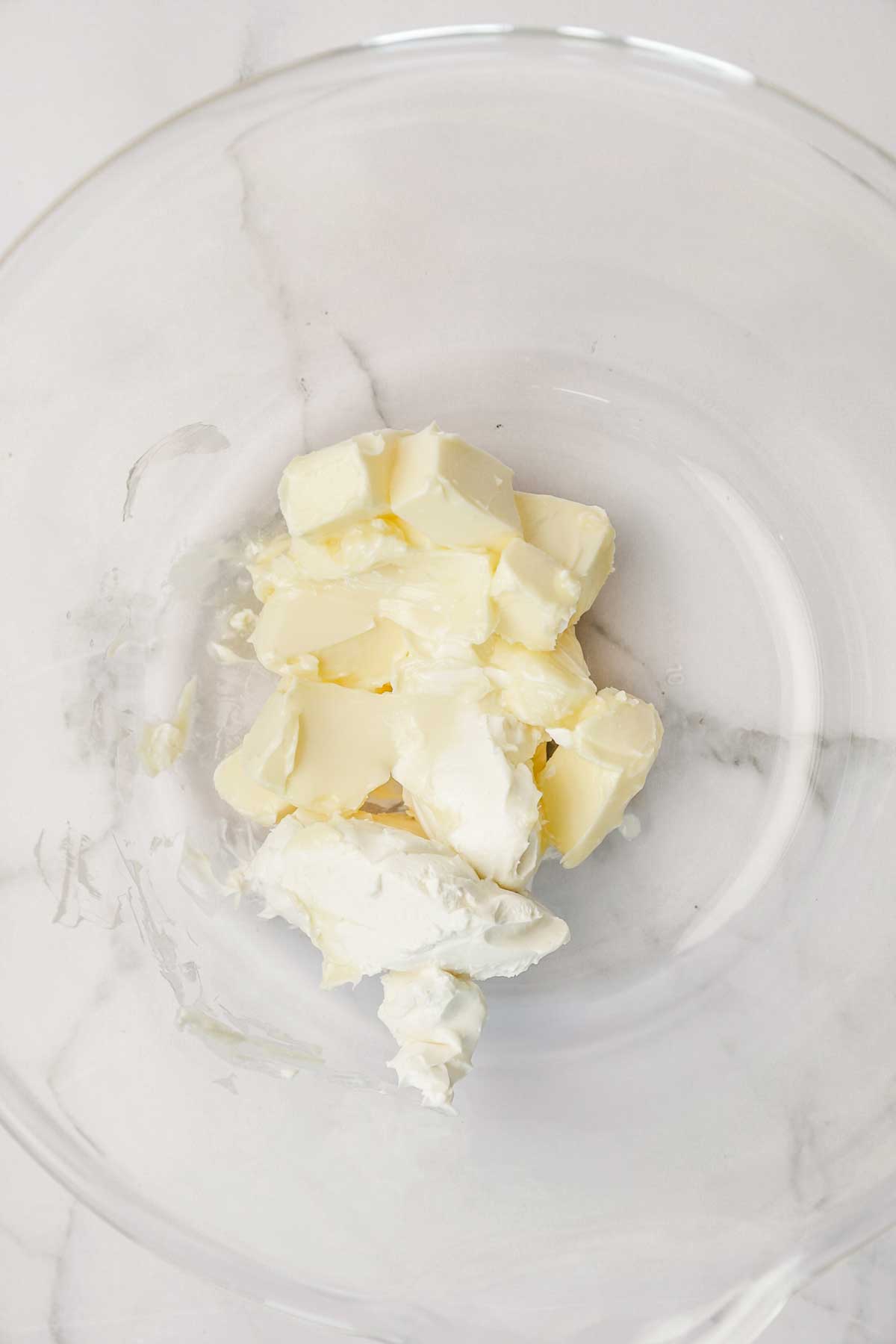 large mixing bowl with cream cheese and butter