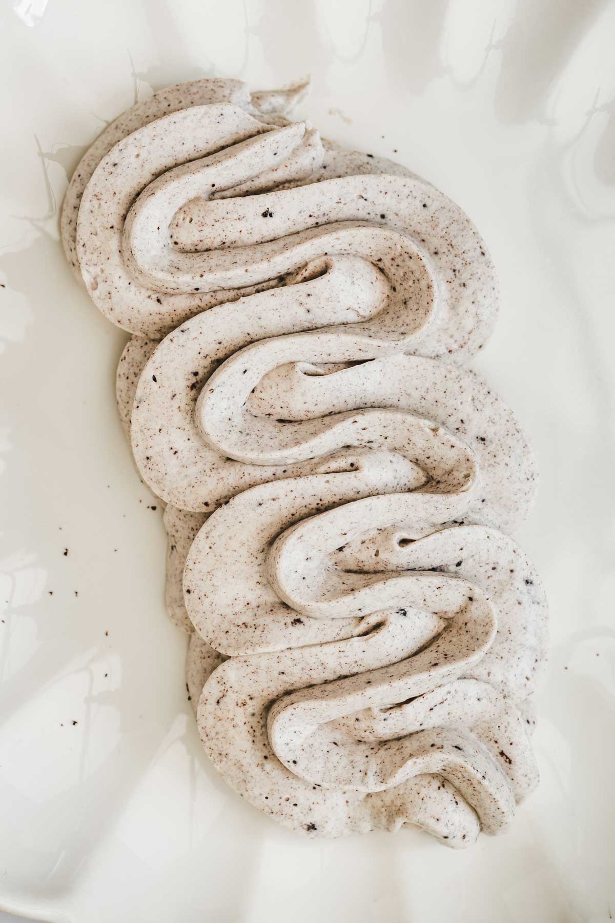 fluffy Oreo frosting piped on a plate for cupcakes