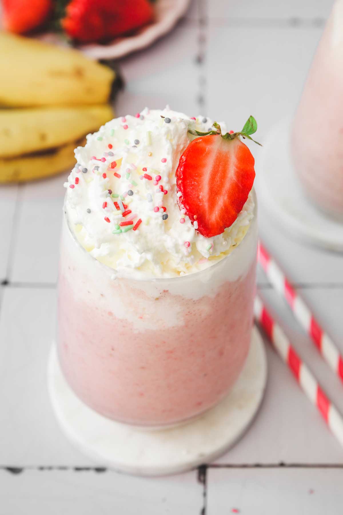 strawberry and banana milkshake on a glass