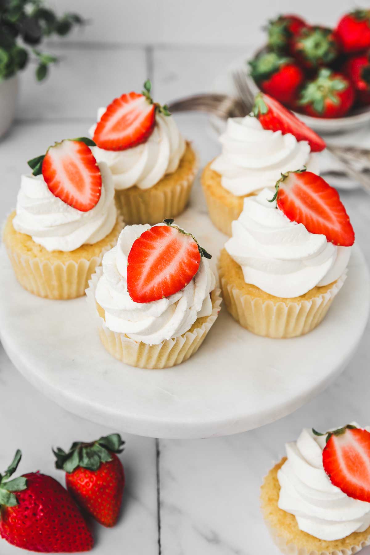 strawberry cupcakes on a cake stand