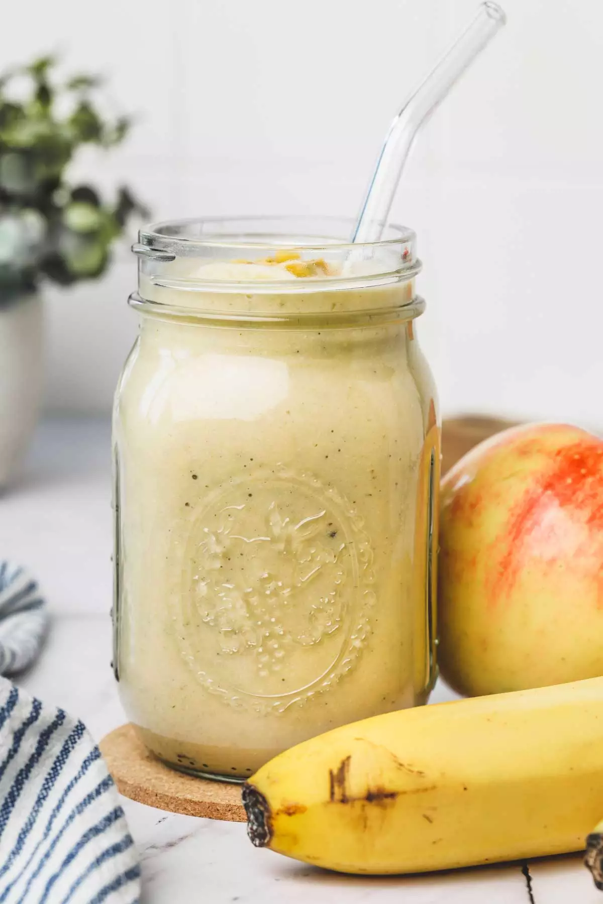 apple banana smoothie on a glass jar
