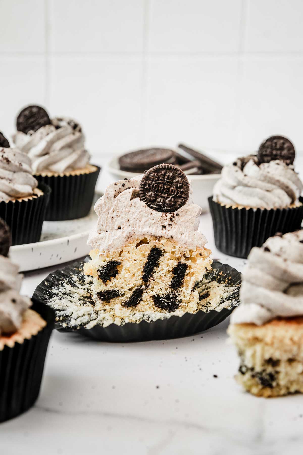 oreo cupcake cut in half showing cookies and cream crumb