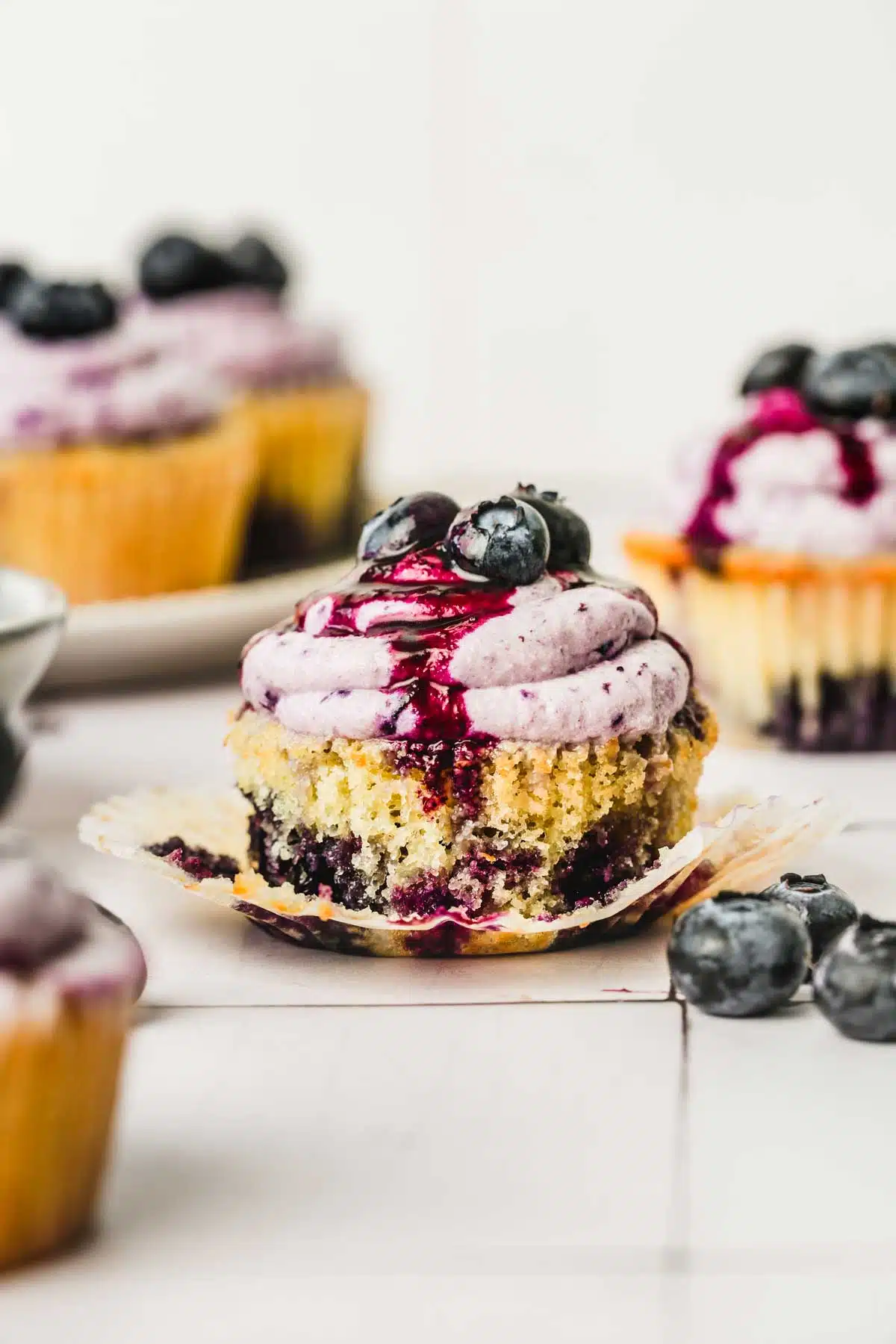 one. blueberry cupcakes with fresh blueberries