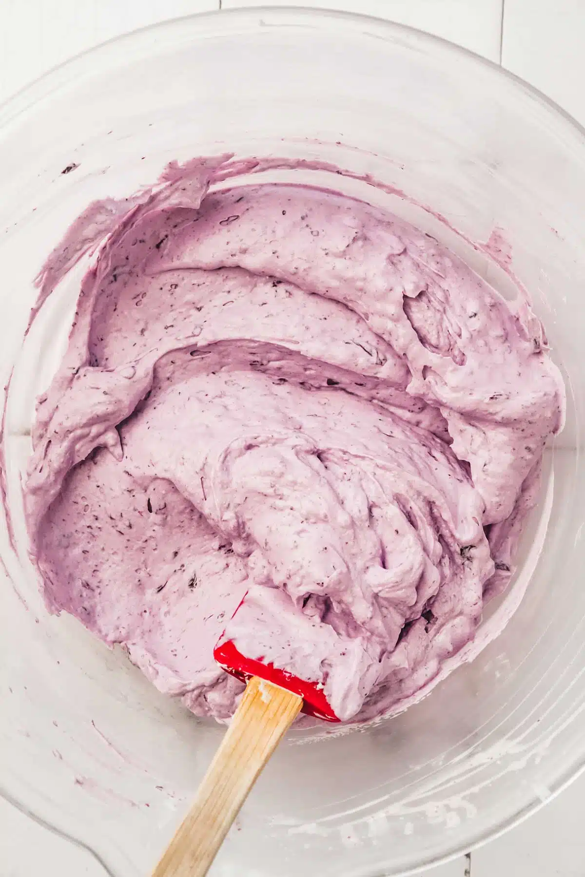 mixing bowl with blueberry frosting