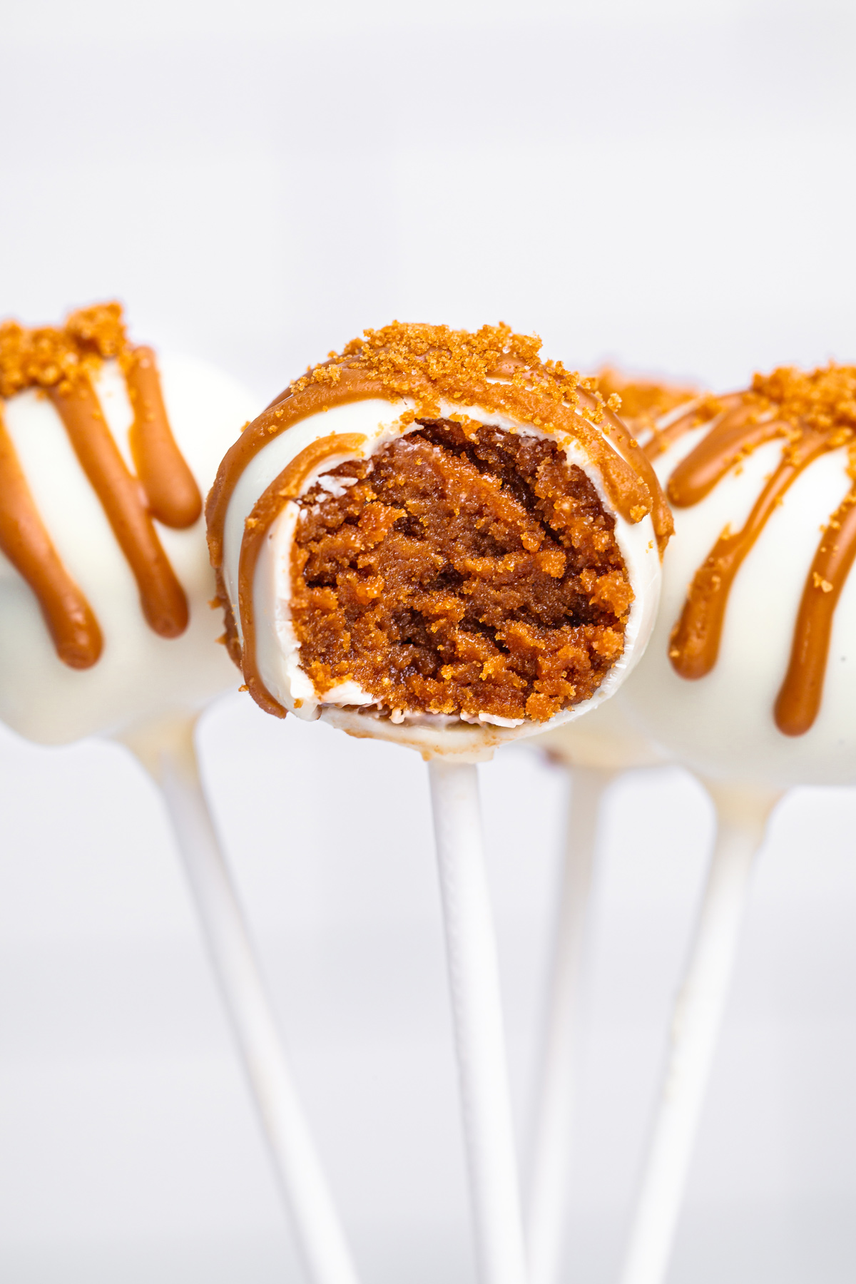 biscoff cake pop bitten showing the creamy center