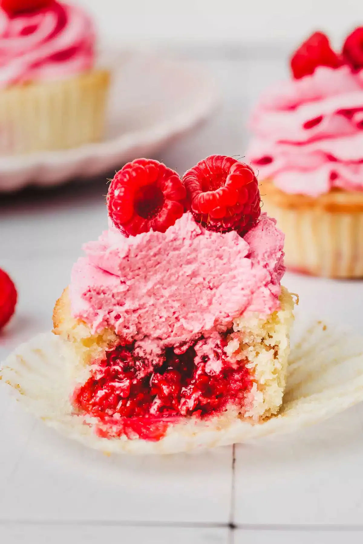half raspberry cupcake on a table
