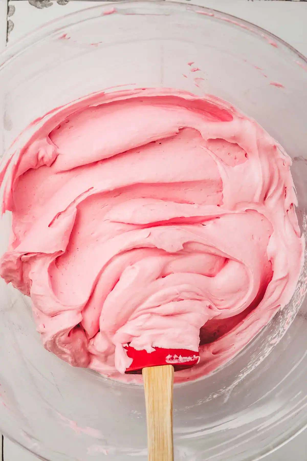 mixing bowl with raspberry frosting