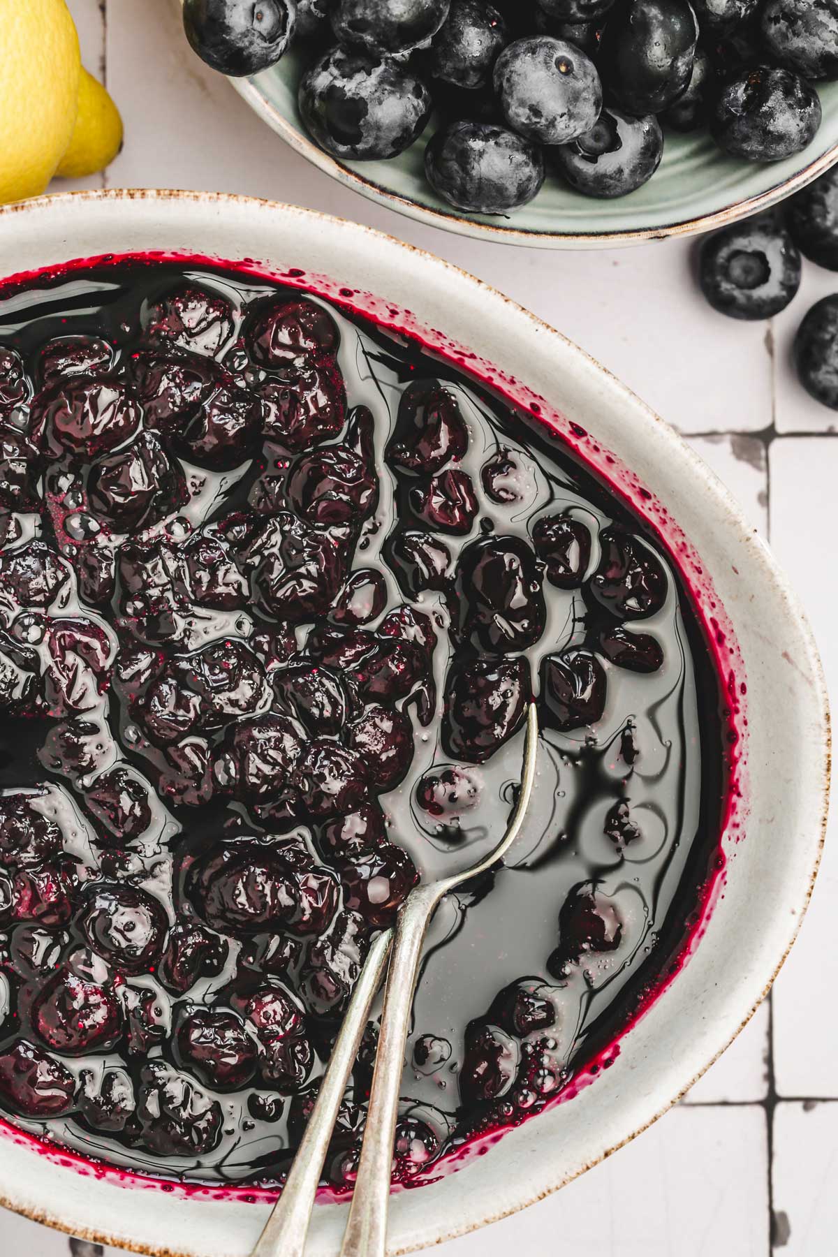 bow with blueberry compote and teaspoons