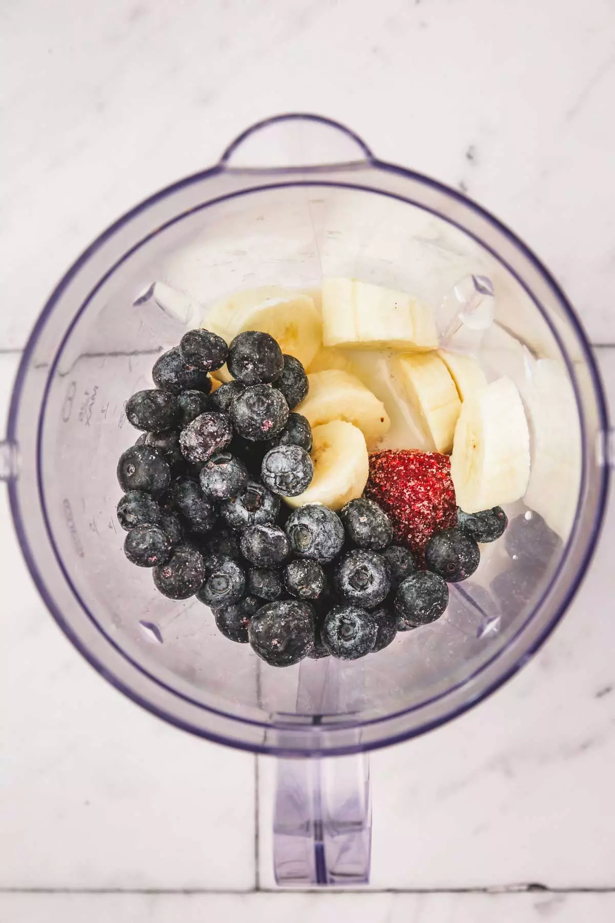 blender bowl with ingredients