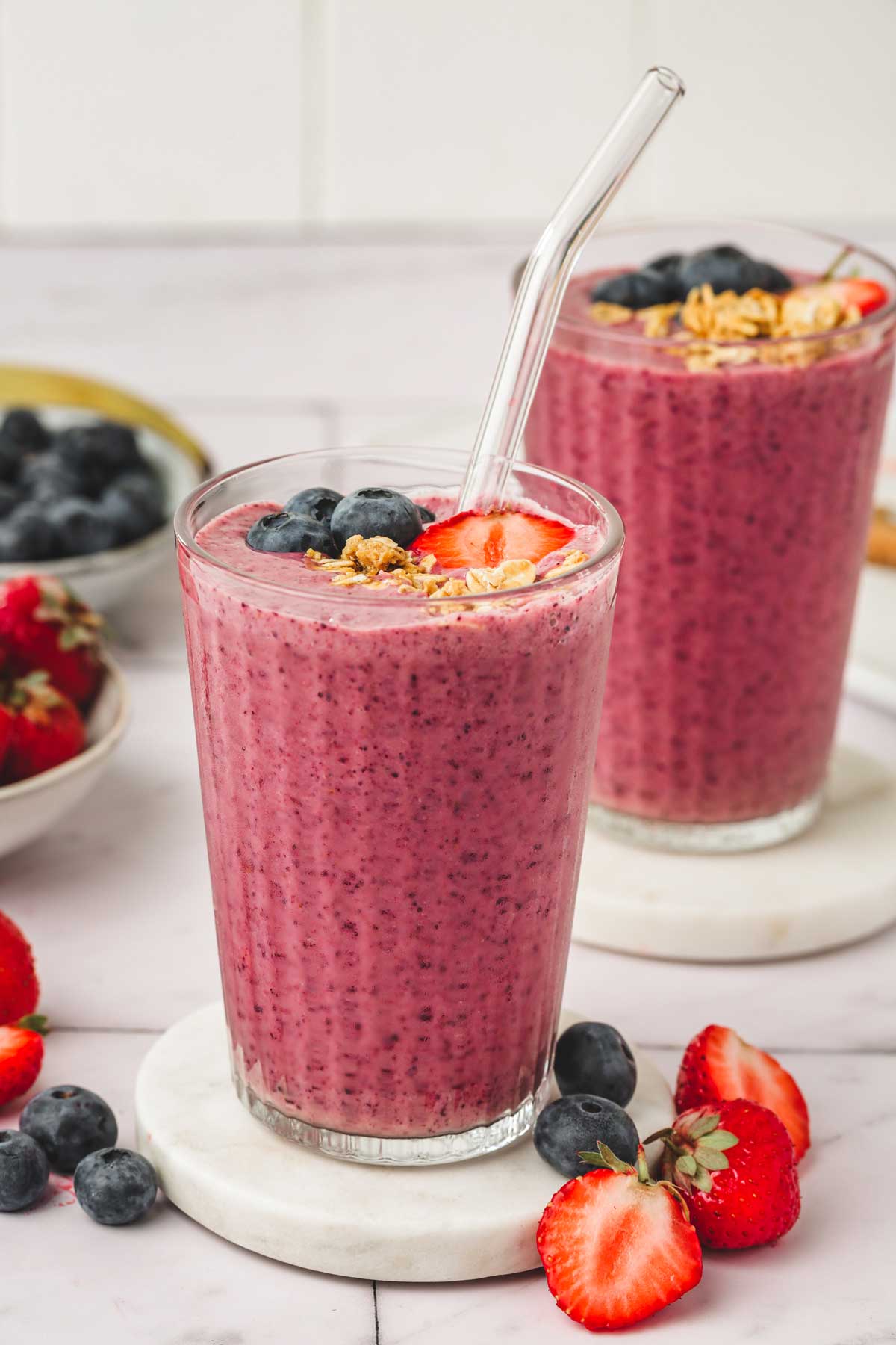 2 glasses of strawberry blueberry smoothies