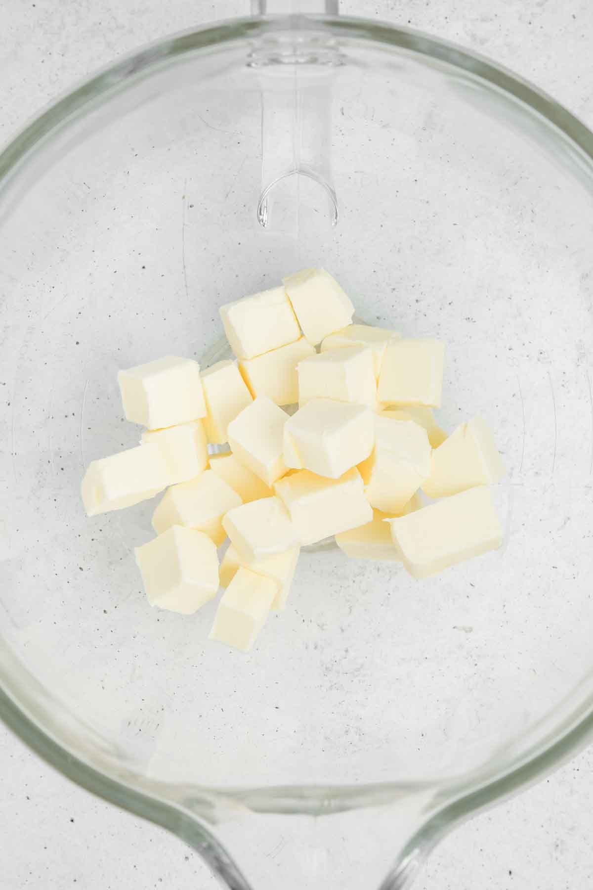 mixing bowl with butter pieces