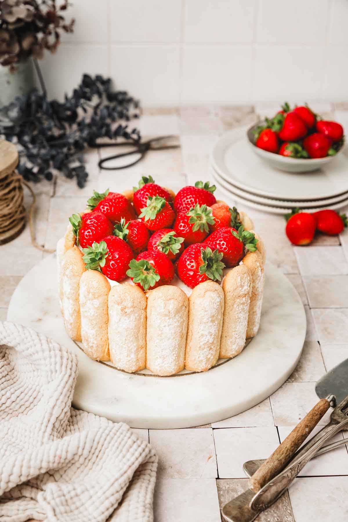 fresh strawberry charlotte cake in a plate placed on a table