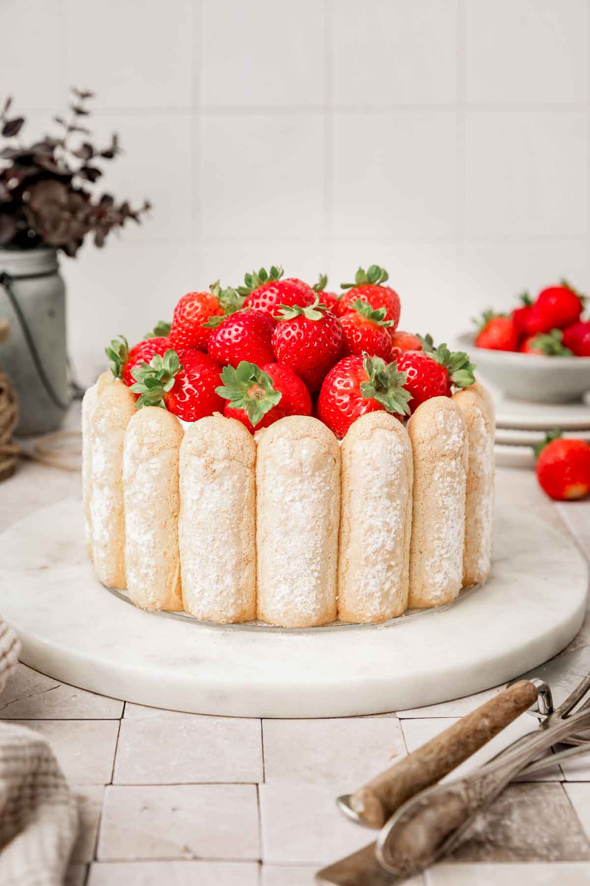 strawberry charlotte cake on a table