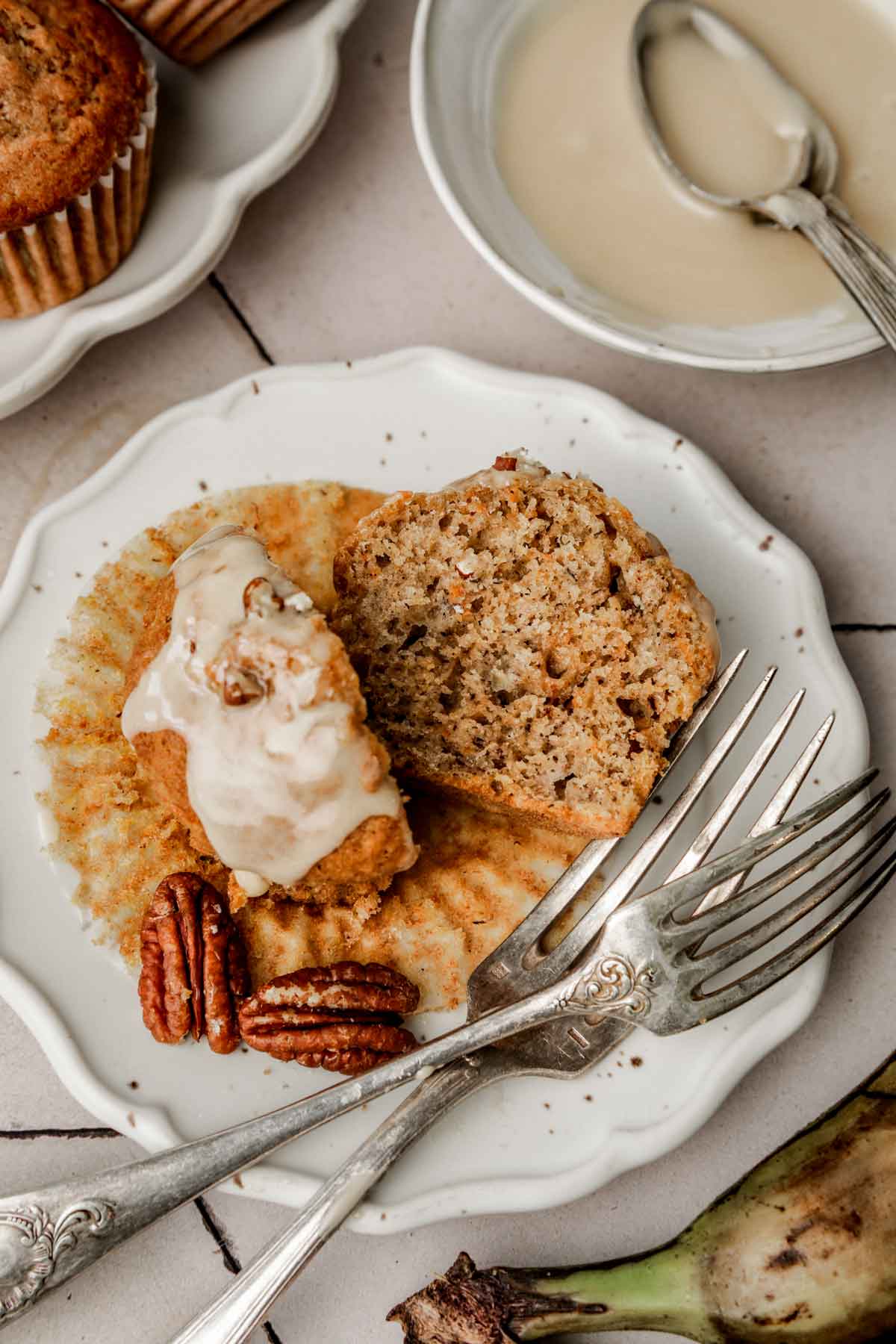 Pumpkin banana muffin cut in half showing its soft, moist crumb