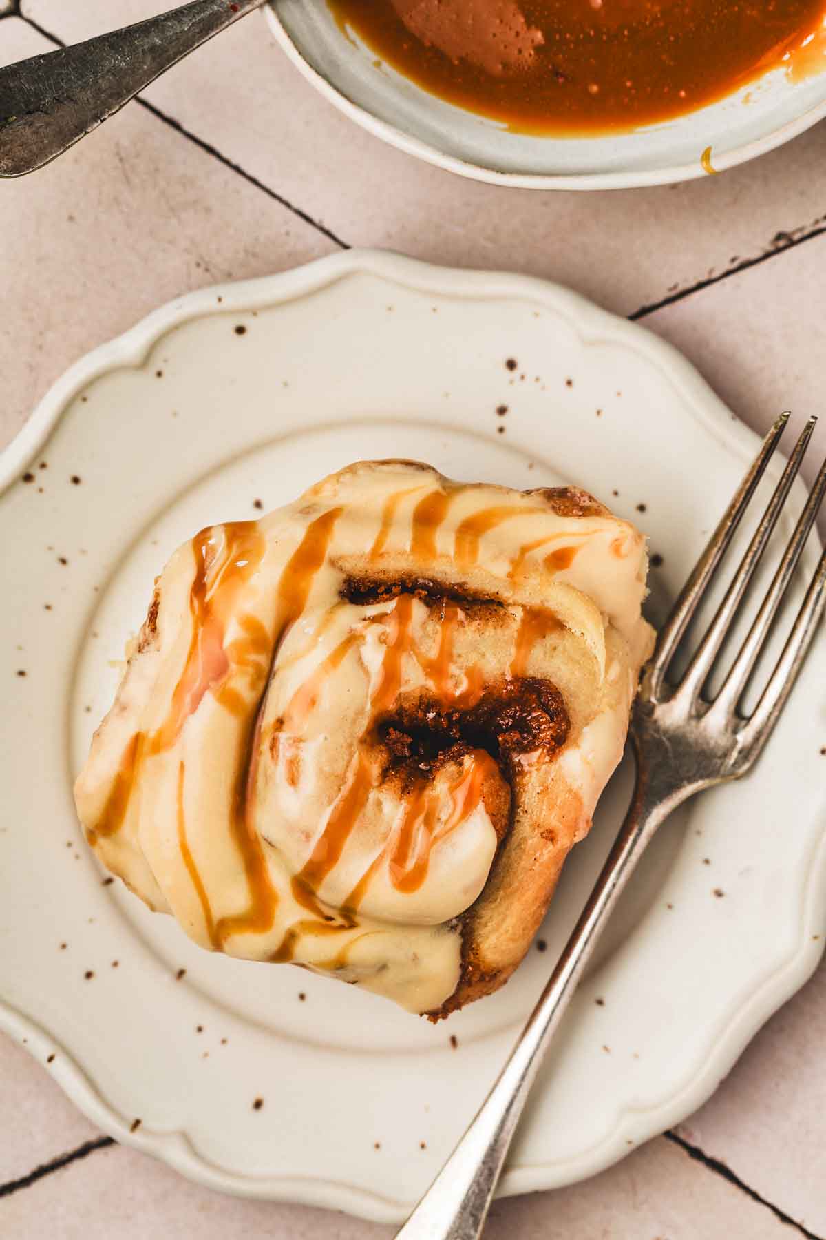 one plate with one caramel cinnamon roll