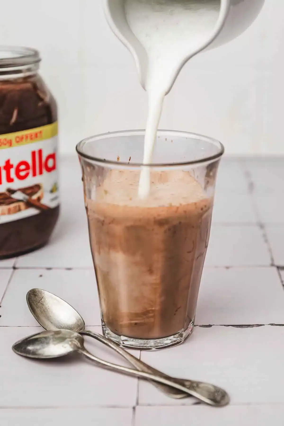 milk poured on a nutella coffee mixture