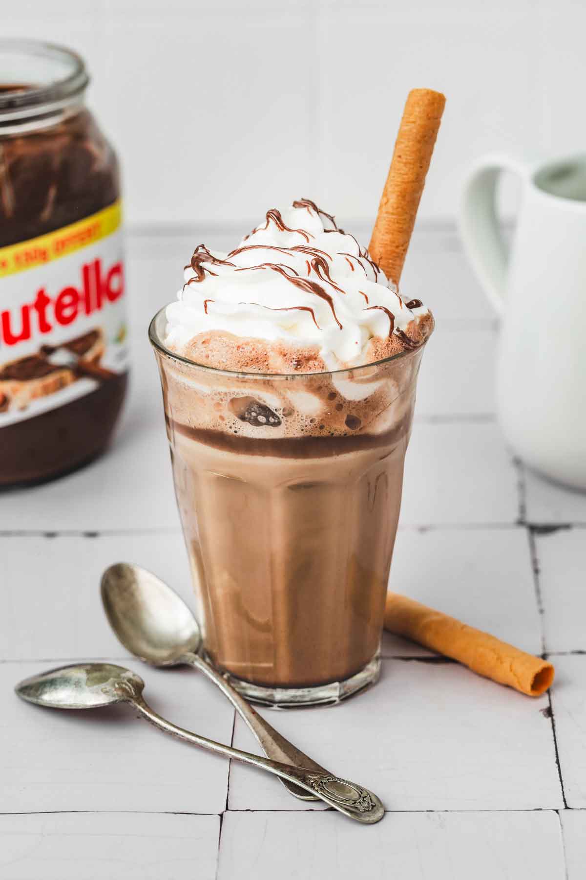 glass with nutella coffee latte on a table