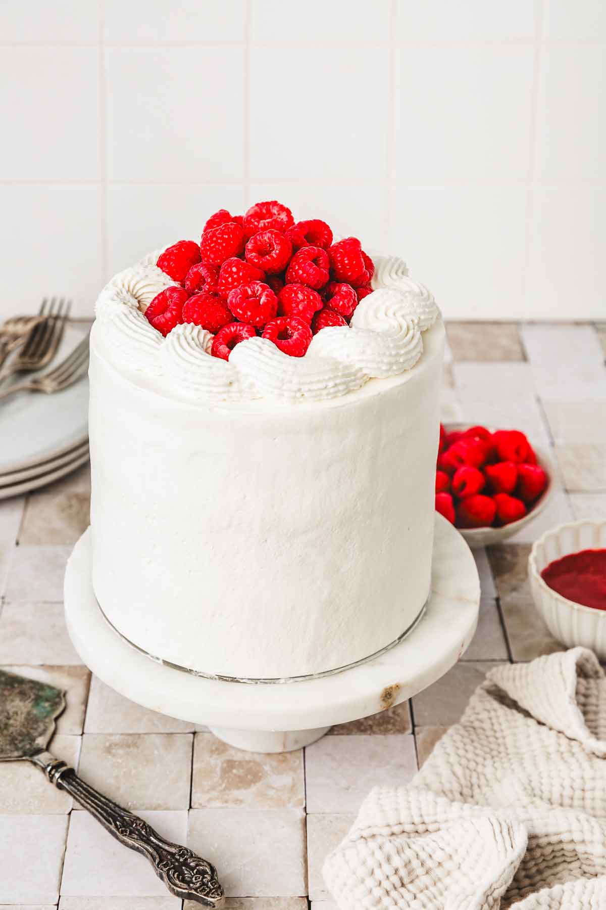 vanilla raspberry cake on a table