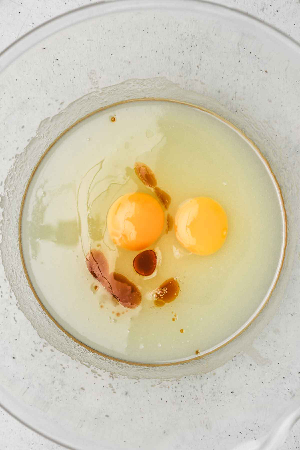 large mixing bowl with egg and oil