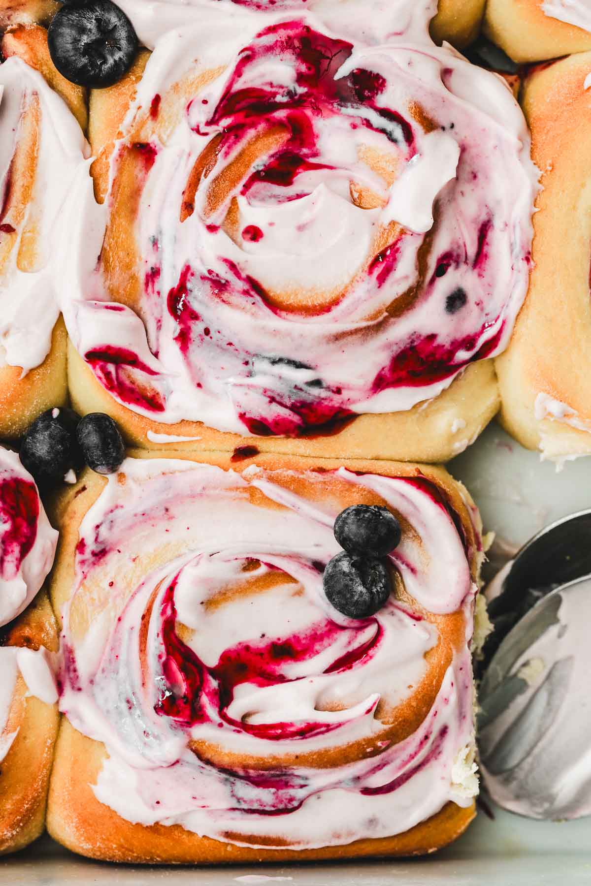 blueberry rolls with a blueberry cream cheese glaze
