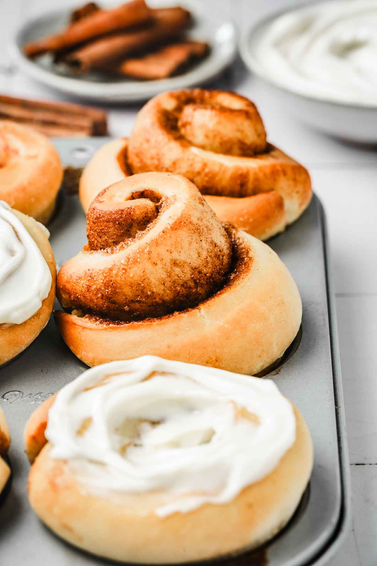 cinnamon rolls muffin in a muffin pan 