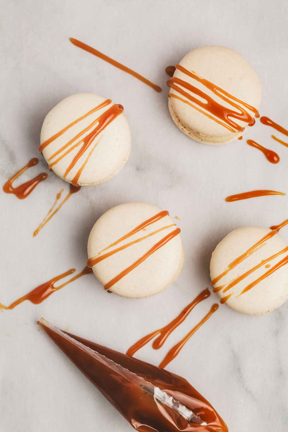 salted caramel macarons on a table