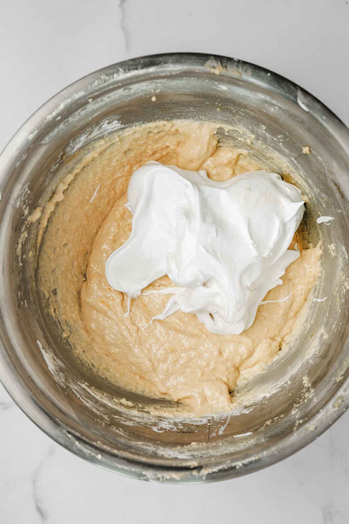 mixing bowl with almond mixture and meringue 