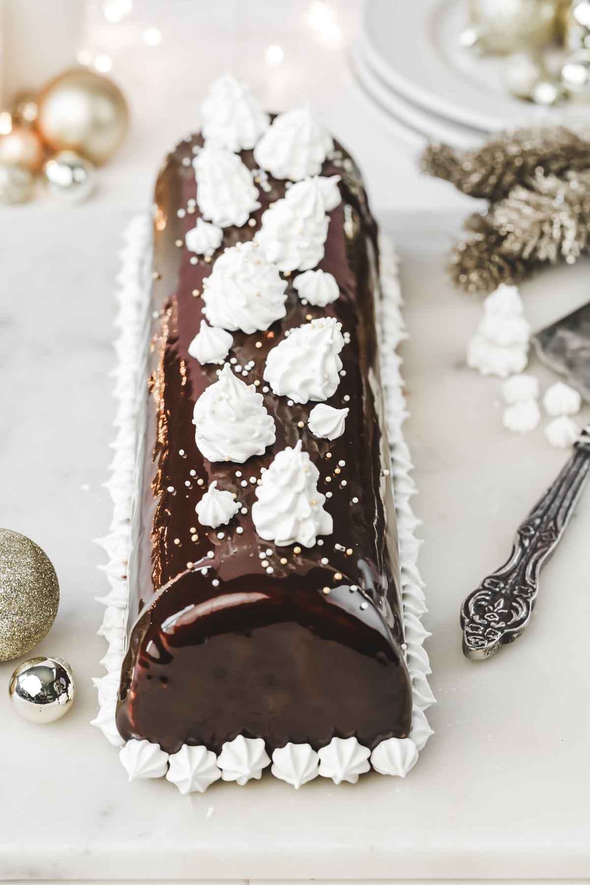 triple chocolate log cake in a plate