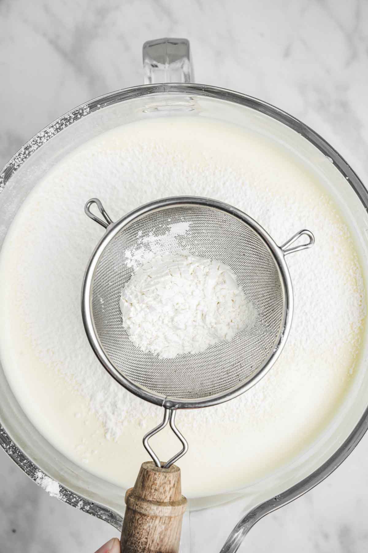 mixing bowl with whipped eggs and flour