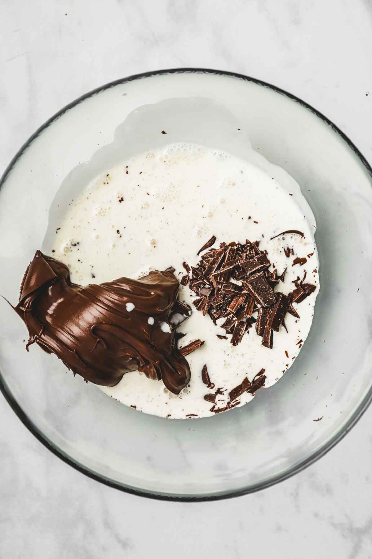 medium bowl with heavy cream with chocolate 