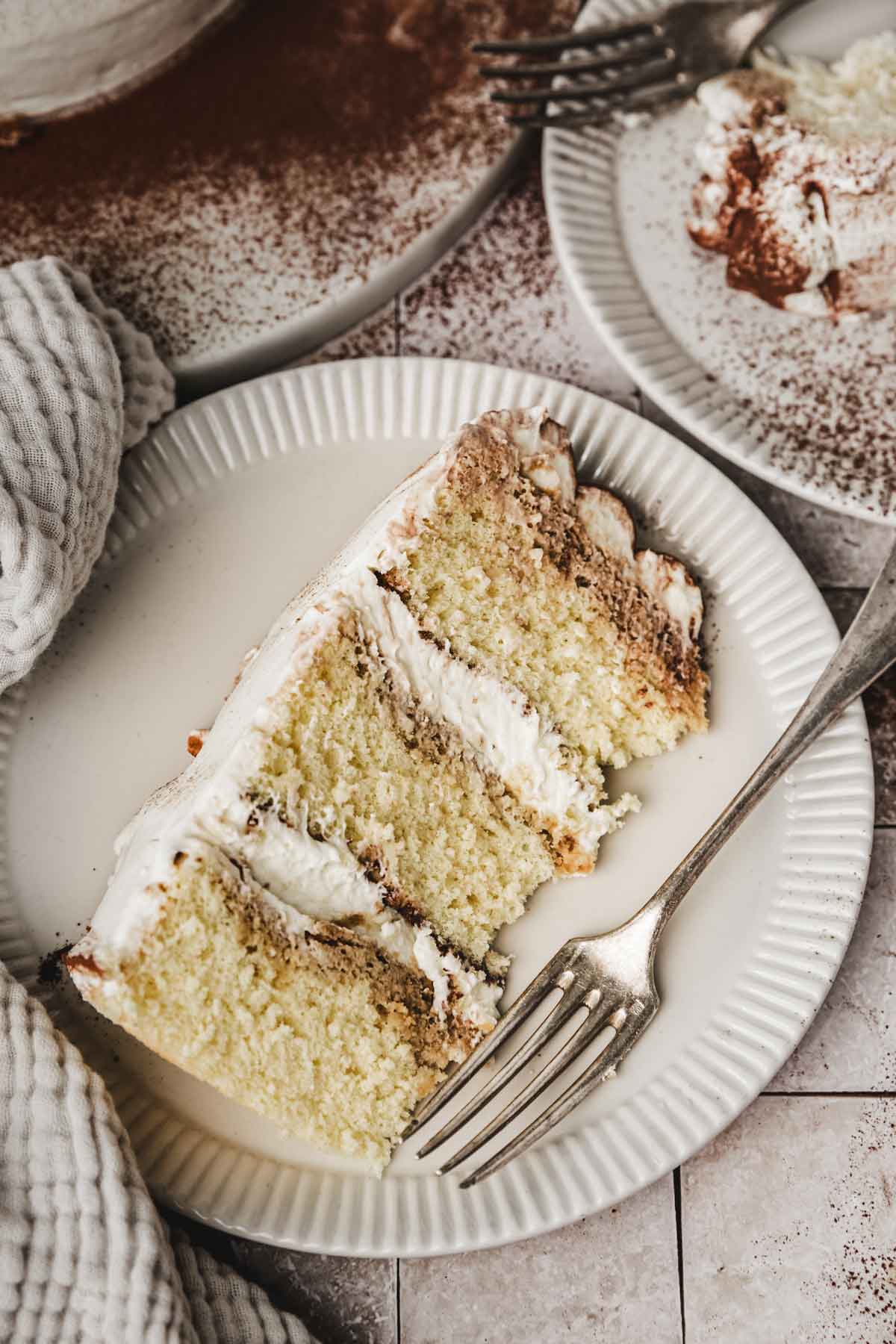 sliced tiramisu cake on a plate