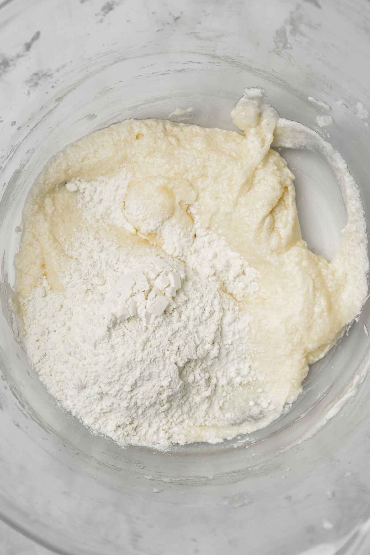 large mixing bowl with vanilla cupcake batter
