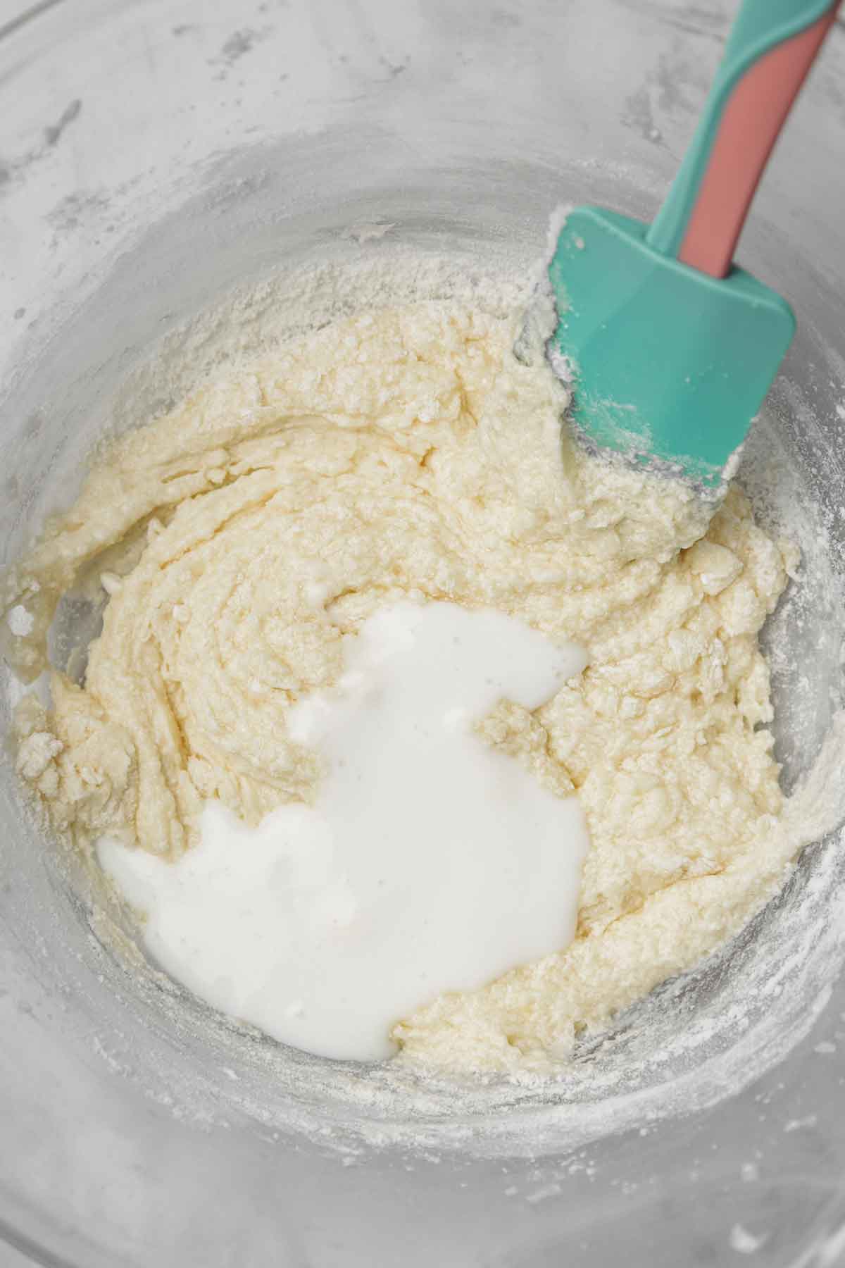 large mixing bowl with vanilla cupcake batter
