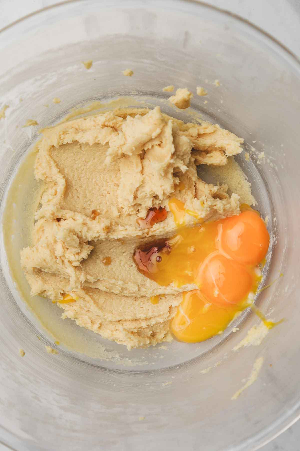 mixing bowl with creamed butter and sugar with egg yolks