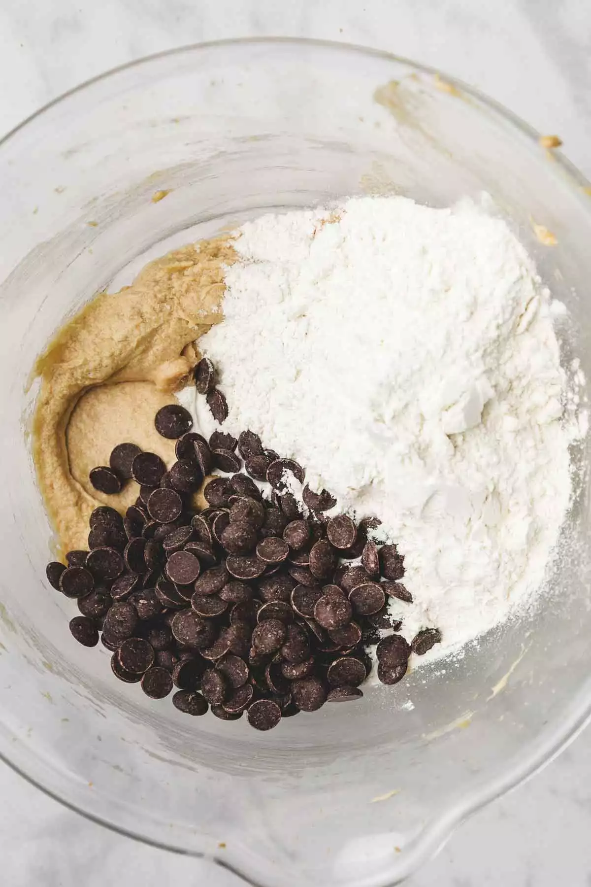 large mixing bowl with flour mixture and chocolate chips