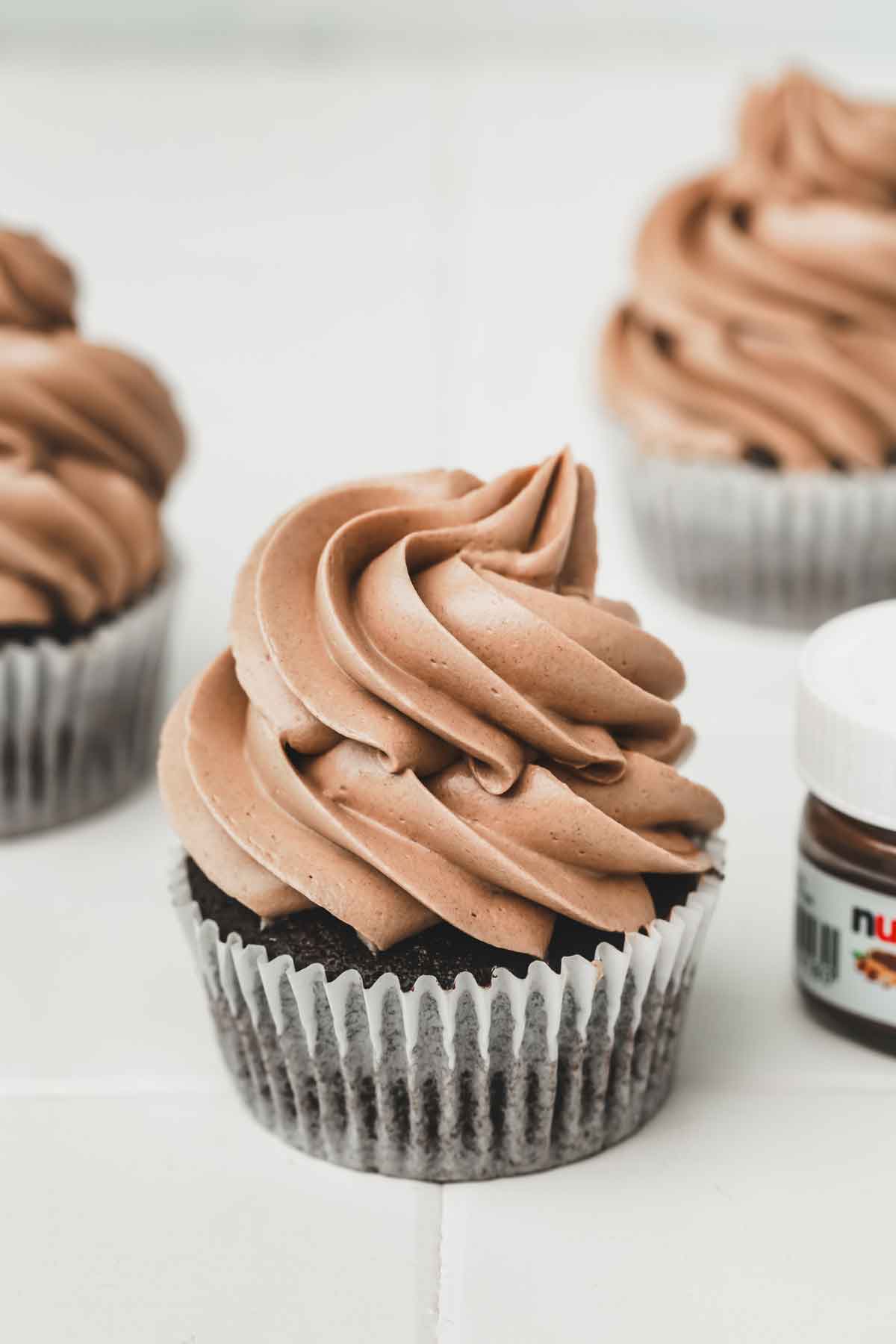 Nutella buttercream cupcakes on a table