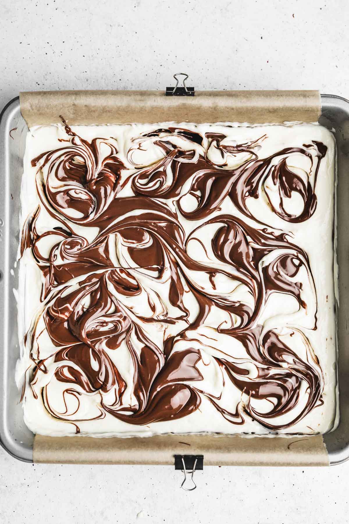 square cake pan with swirled nutella cream cheese mixture