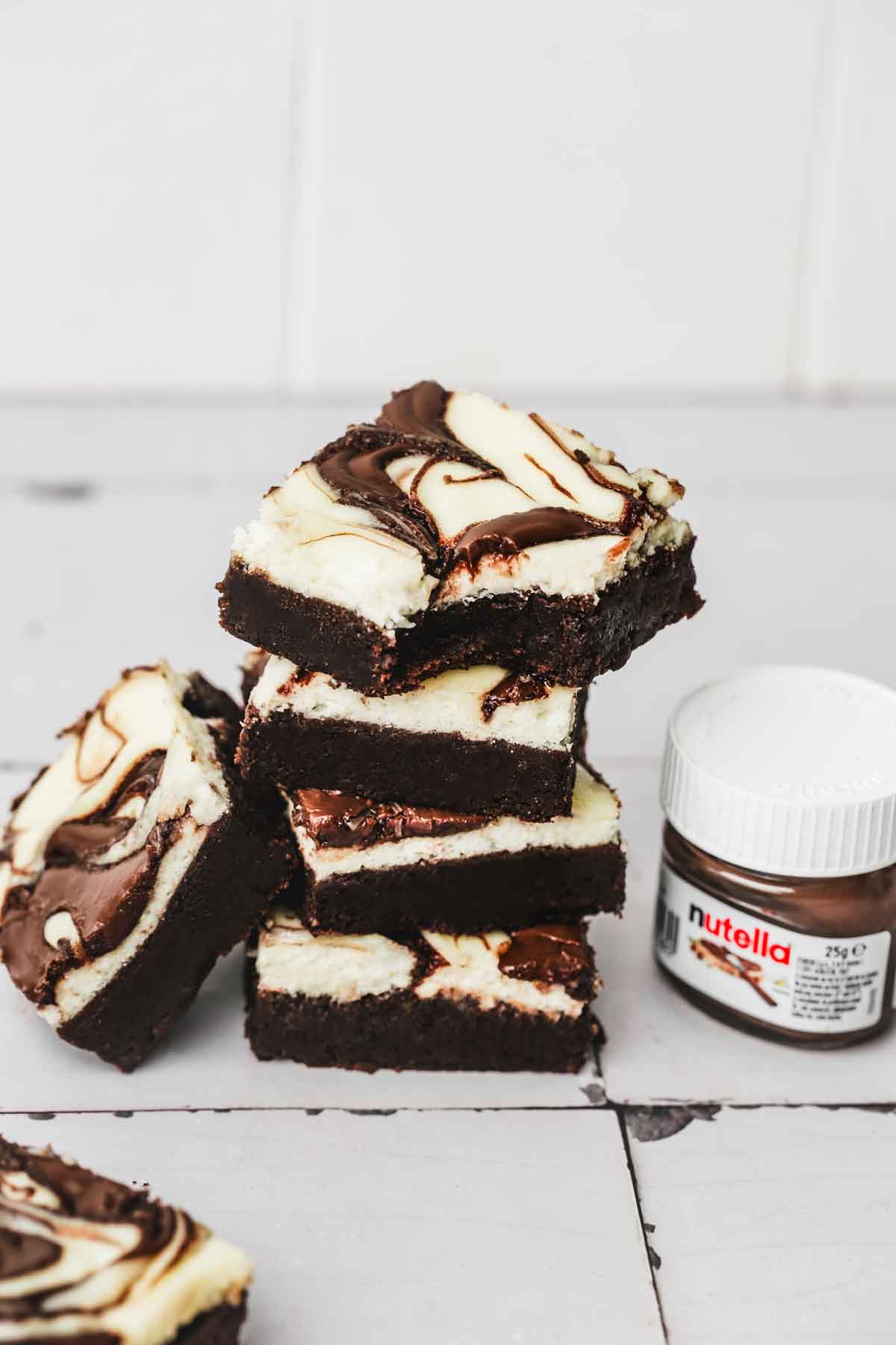square of nutella cheesecake brownies on a table